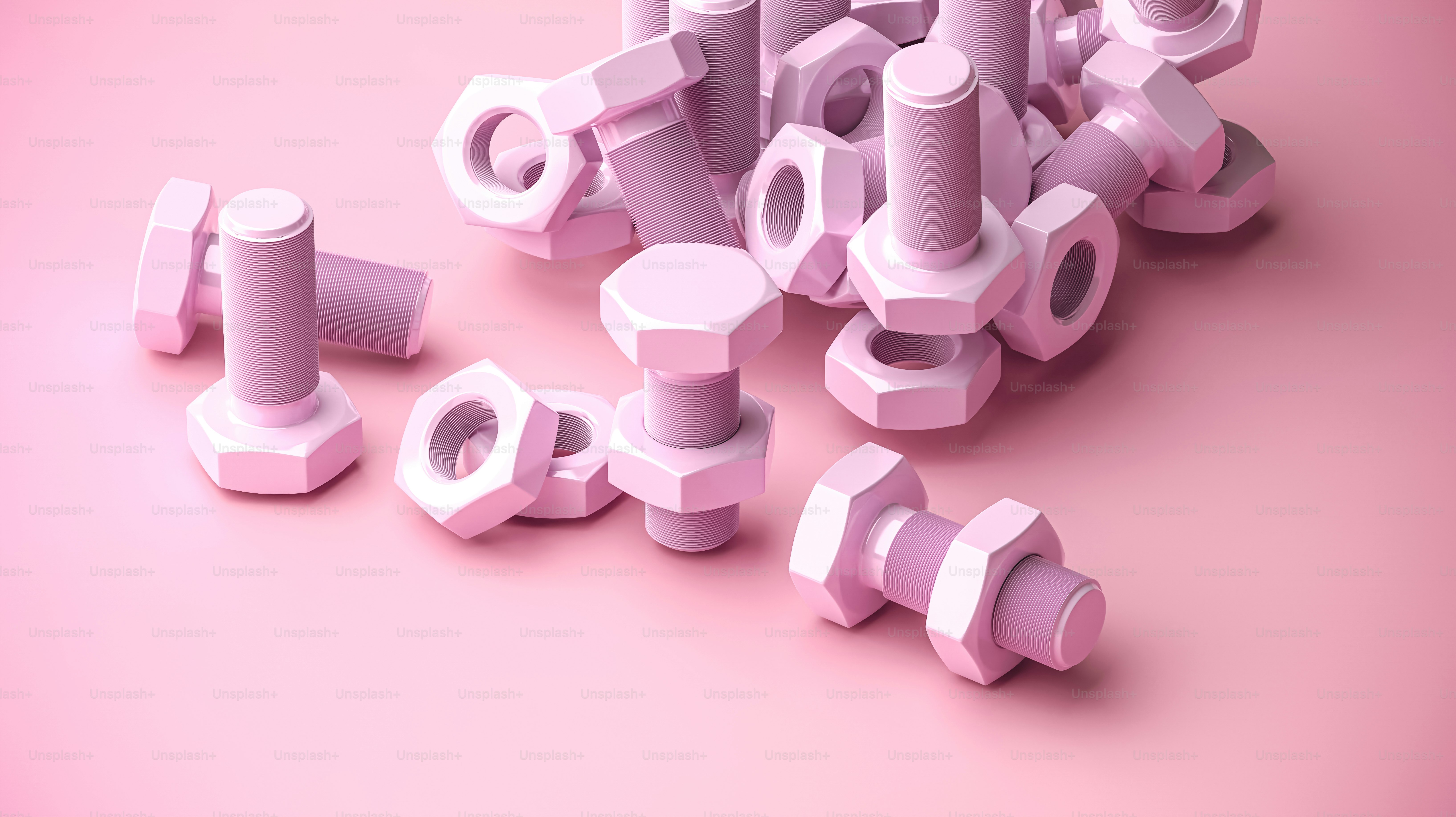 a pile of pink plastic objects on a pink background
