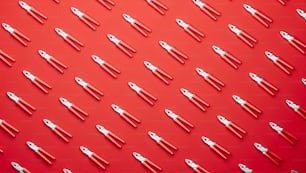 a red background with a lot of tools on it