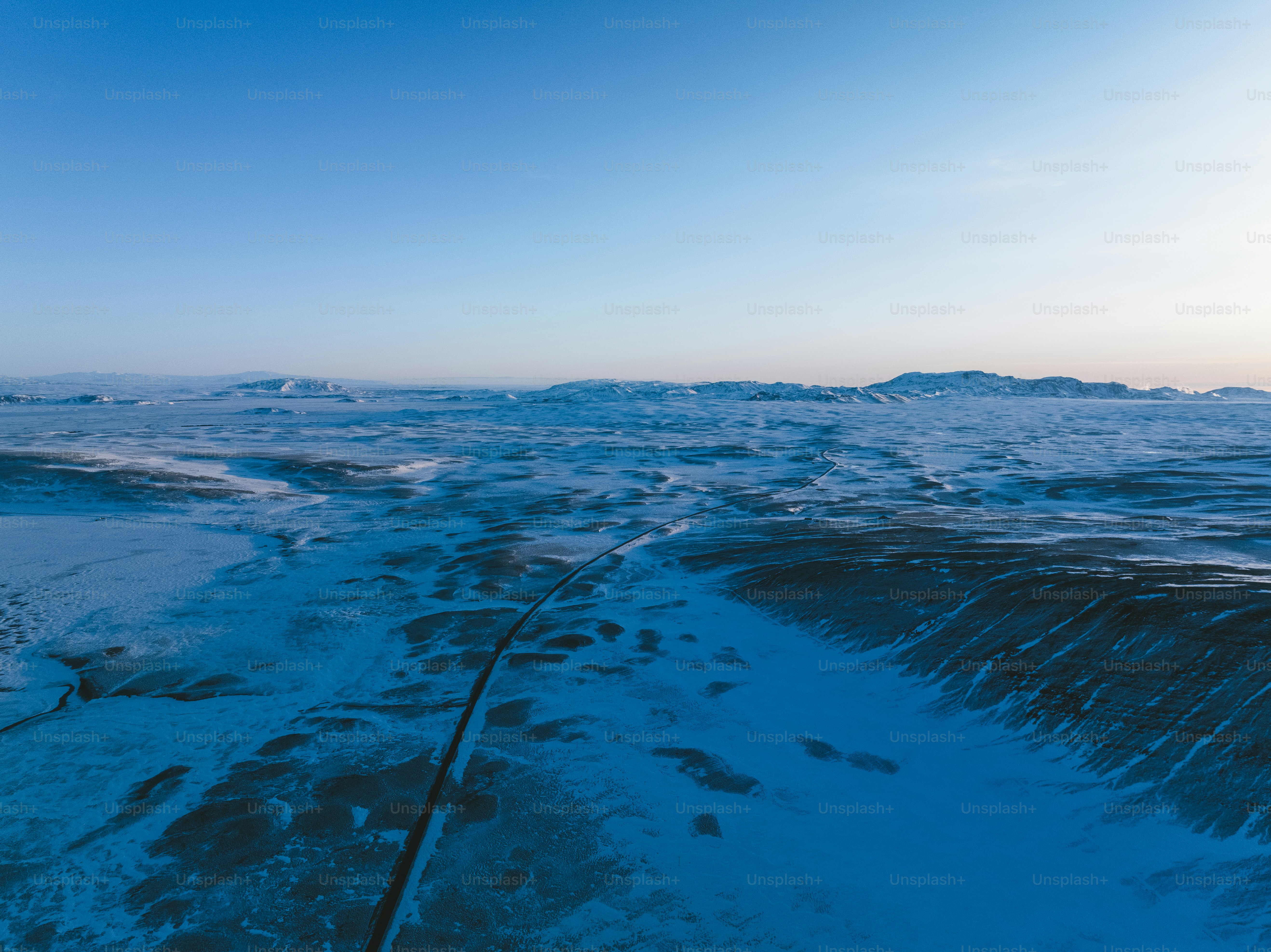 An aerial view of a snow covered area photo – Texture Image on Unsplash