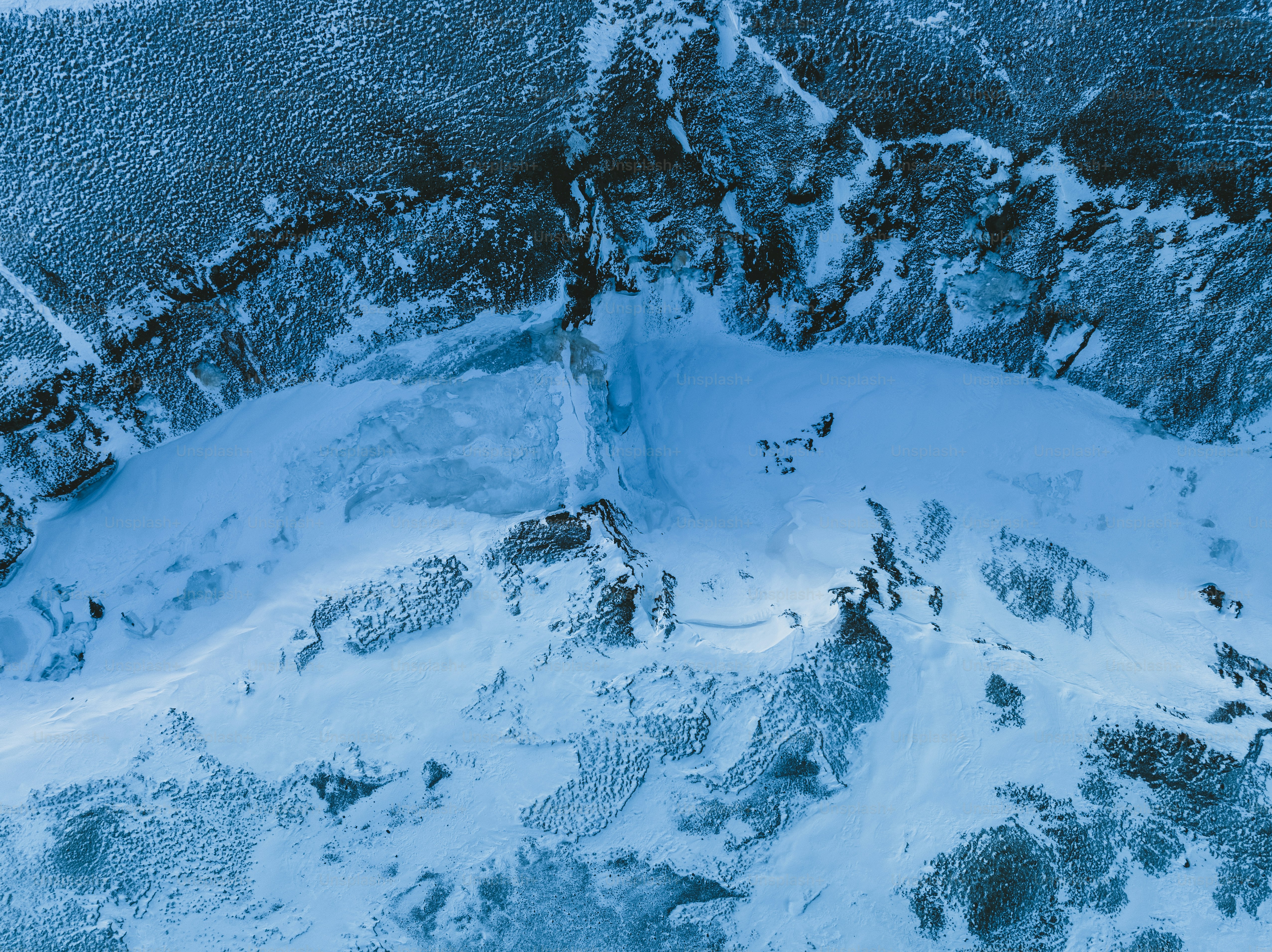 An aerial view of a snow covered area photo – Texture Image on Unsplash
