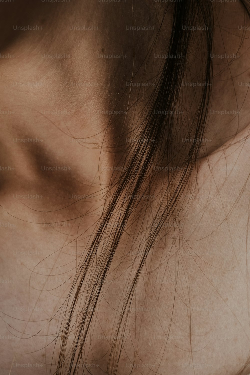 a close up of a person's hair and neck