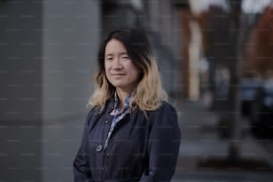 a woman standing in front of a building