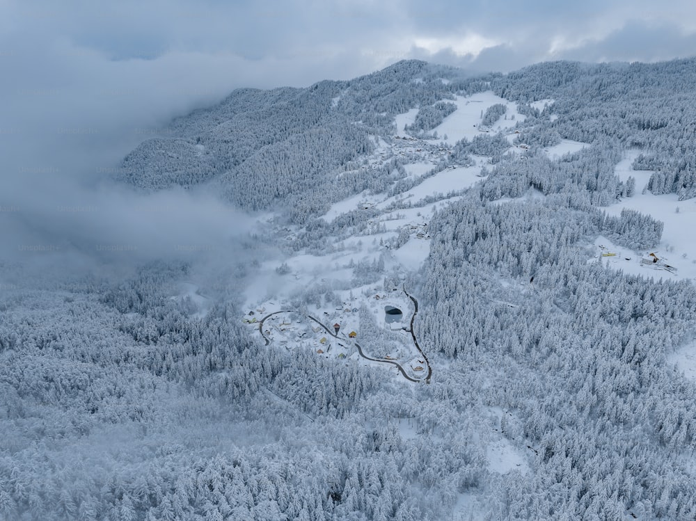 an aerial view of a ski resort surrounded by trees
