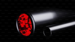 a close up of a red light on a black background