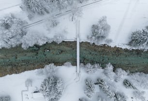 an aerial view of a snow covered forest