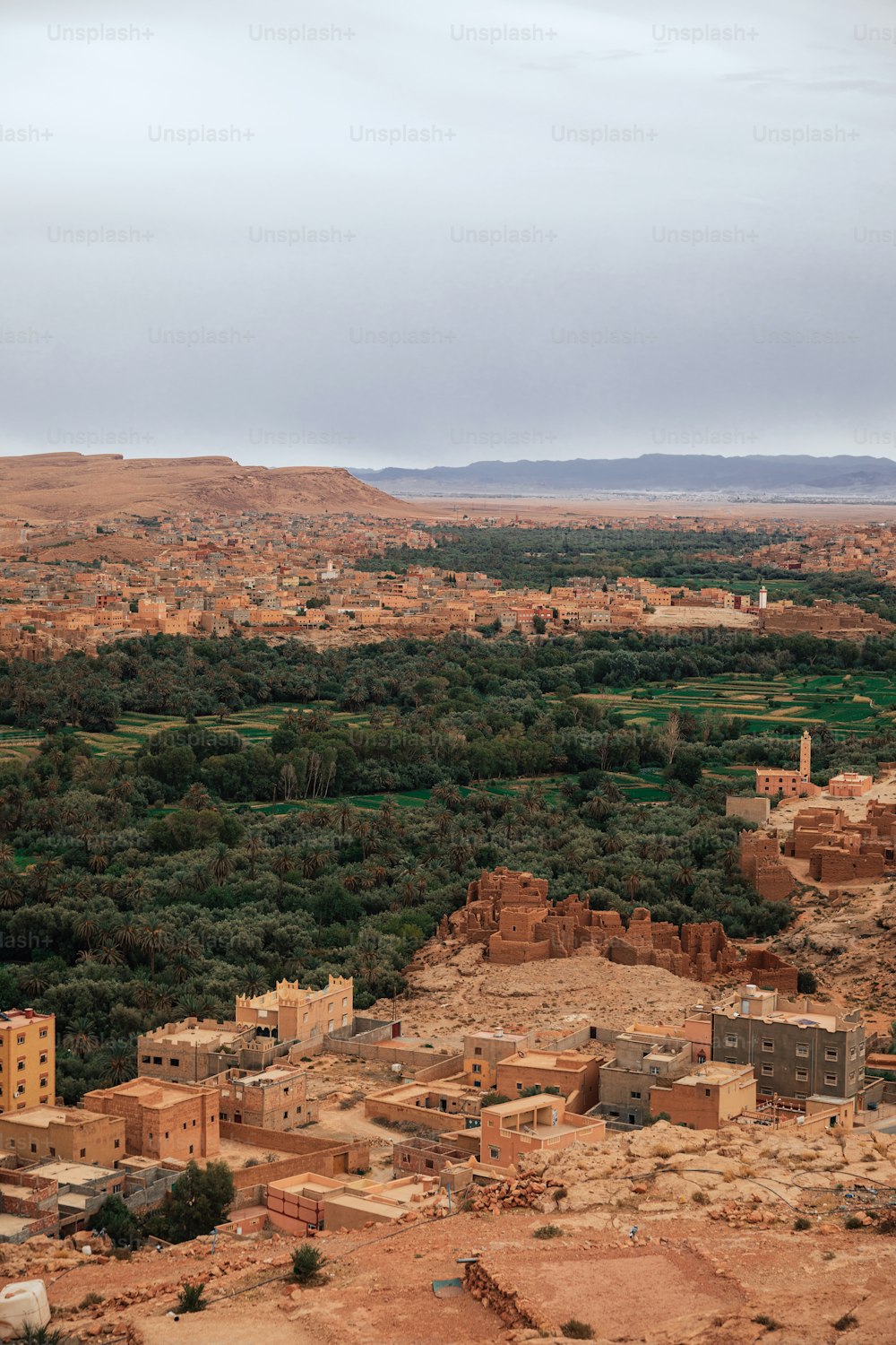 a view of a small village in the middle of a desert