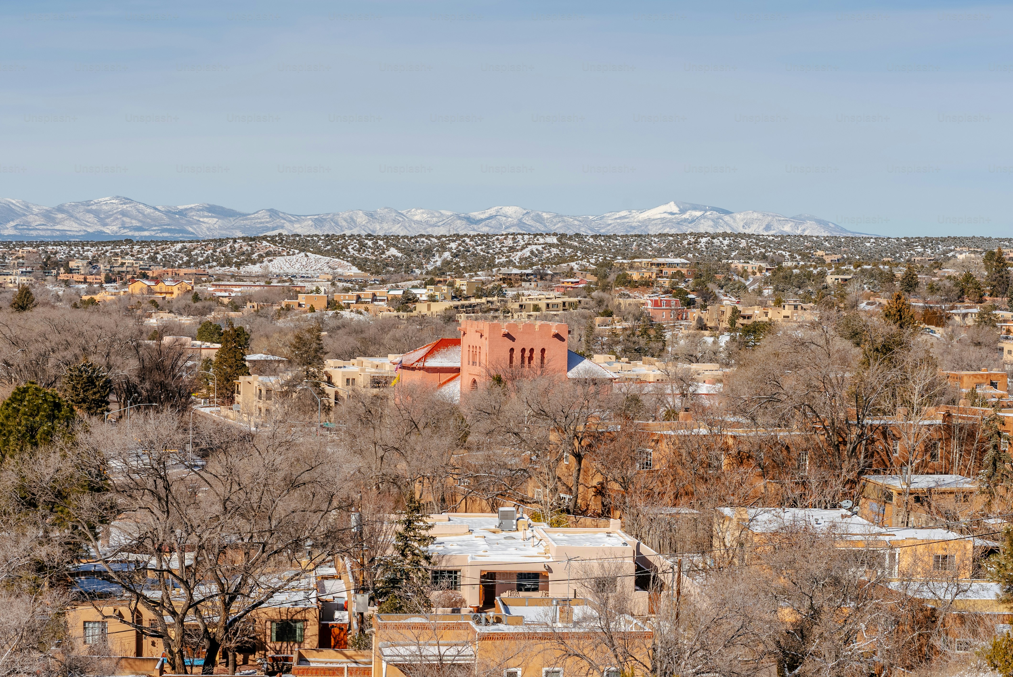 a view of a city with mountains in the background