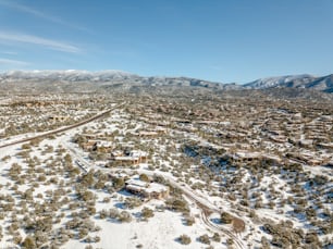 an aerial view of a snow covered town