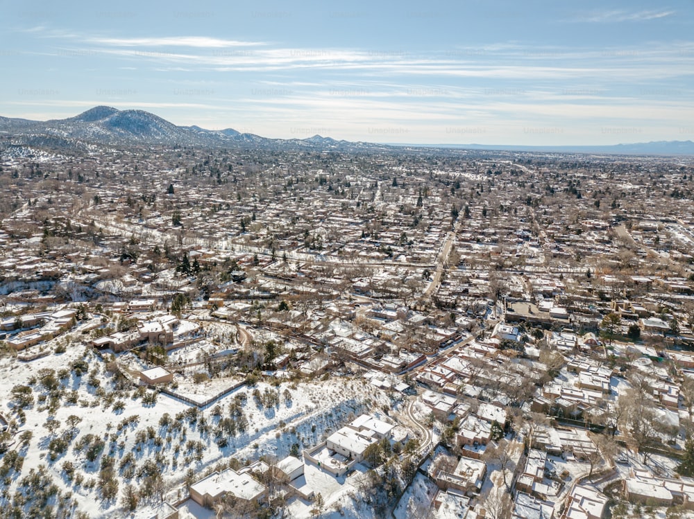 an aerial view of a city in winter