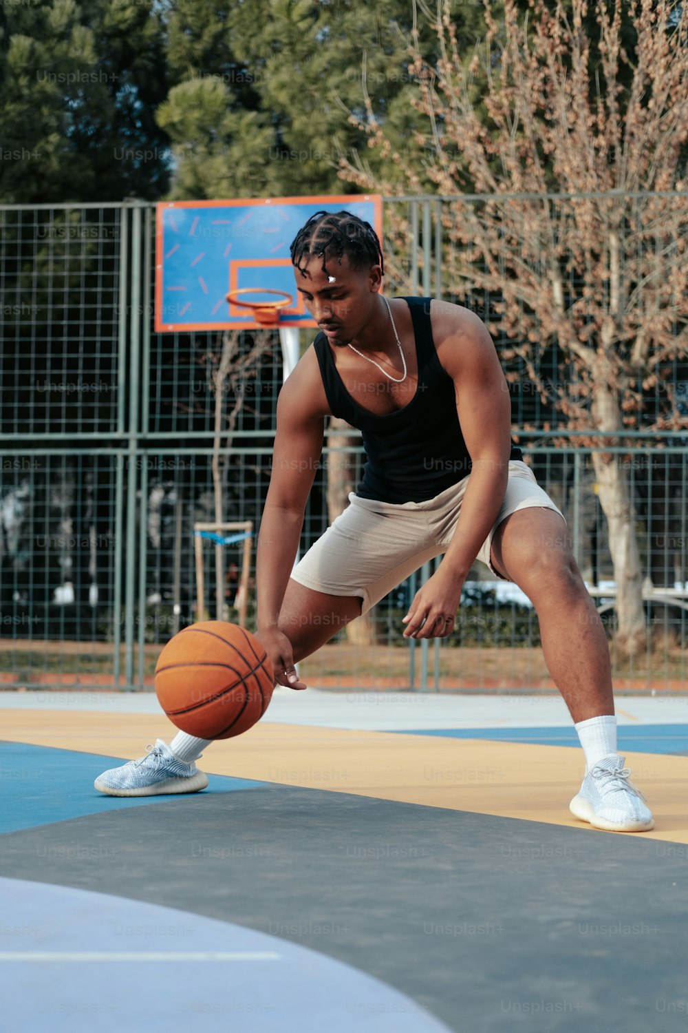 a man is playing basketball on a court