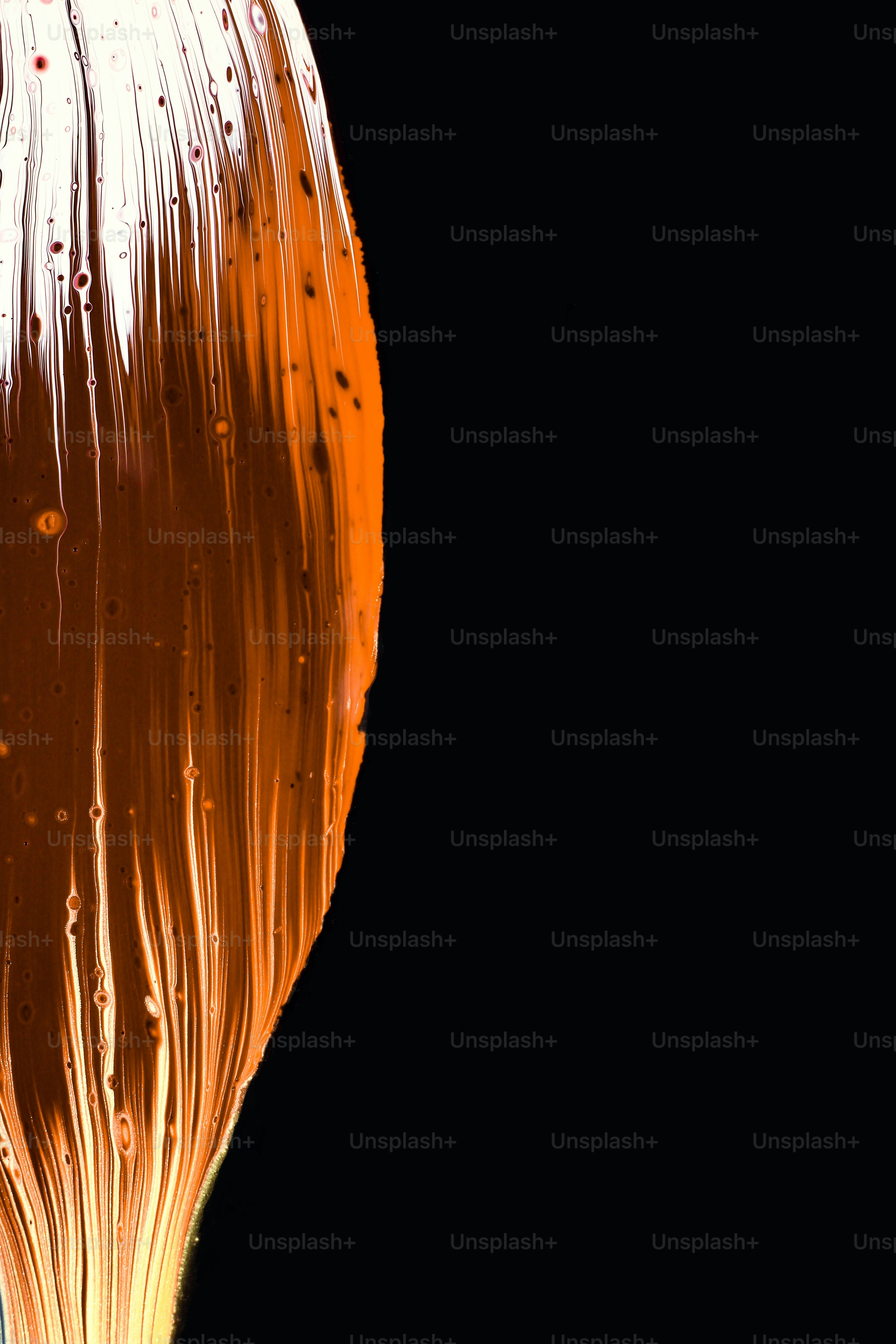 a glass filled with liquid on top of a table