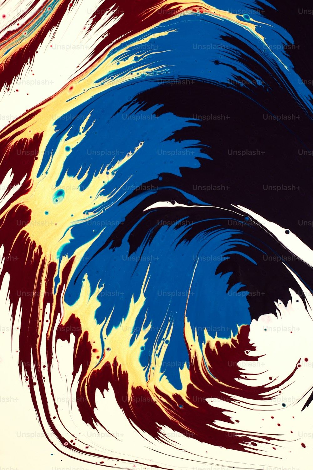 an abstract painting of blue, yellow, and red swirls