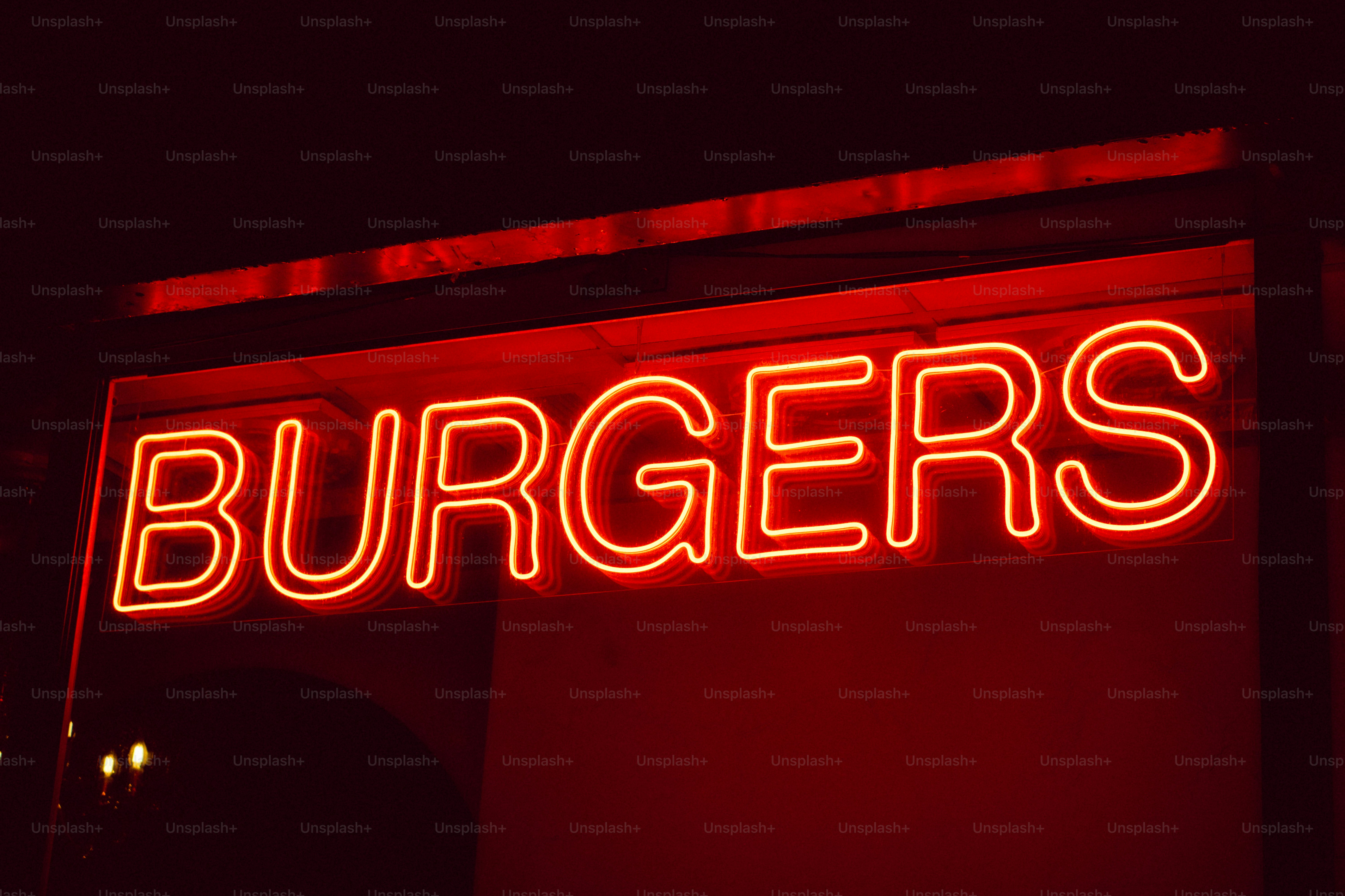 a neon sign that says burgers on it