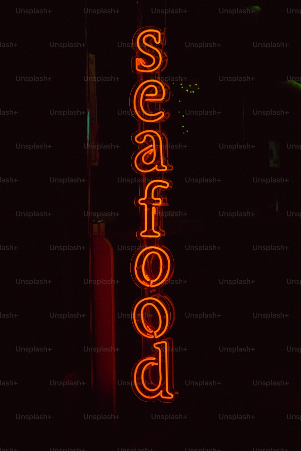 a neon sign that says seafood on it