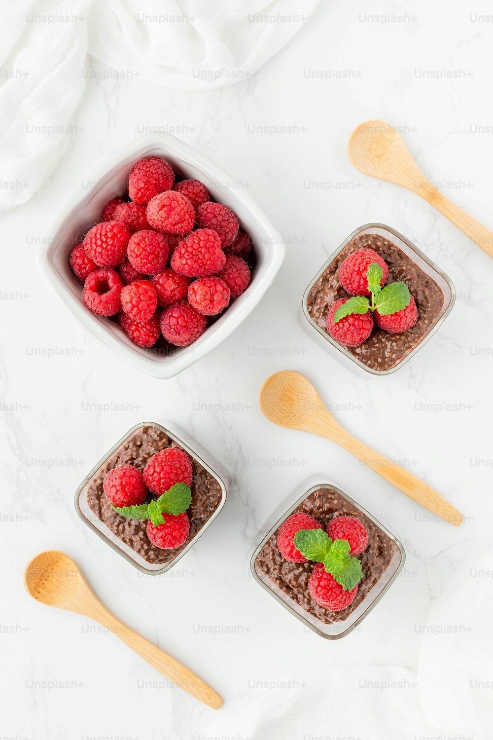 a bowl of chocolate pudding with raspberries on top
