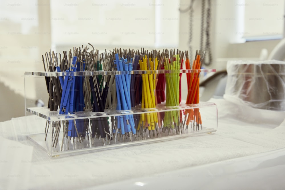 a bunch of different colored umbrellas in a holder