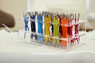 a display case filled with lots of different colored toothbrushes