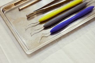 a tray that has some pens and scissors on it