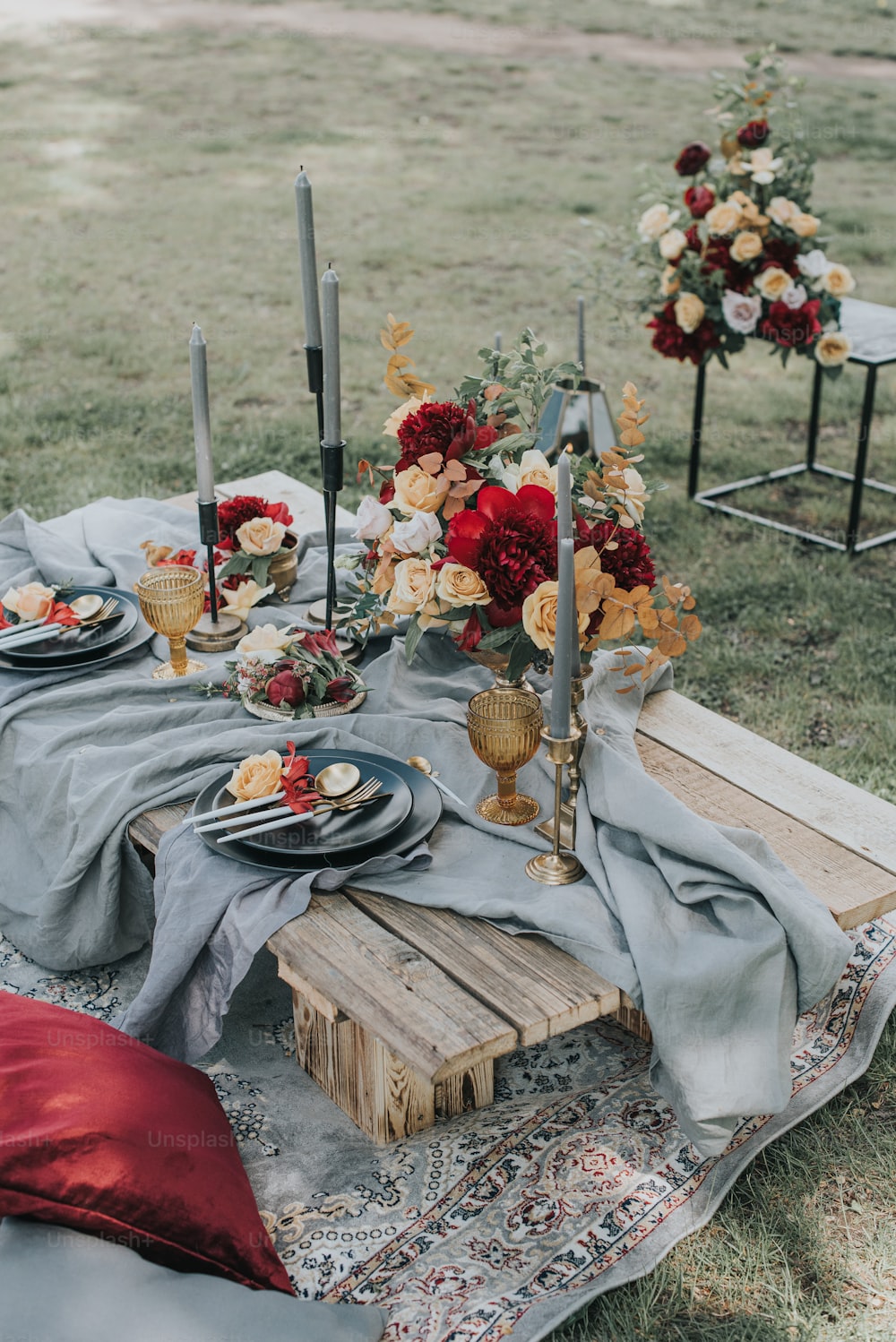 a table set up with flowers and candles
