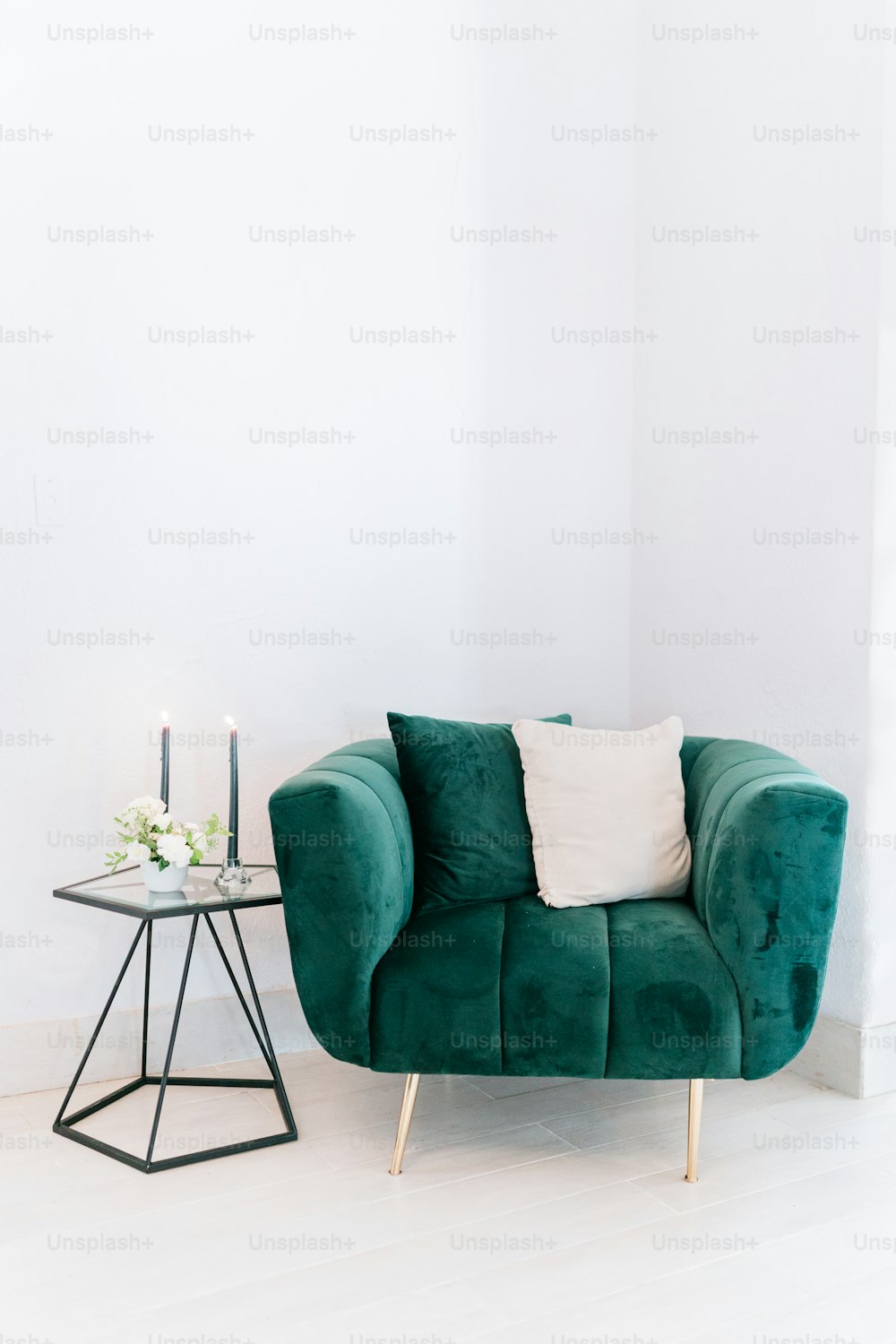a green chair and a table in a room