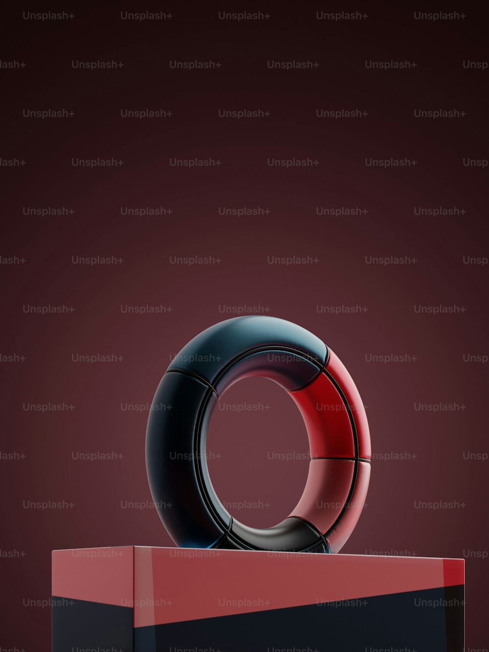 a red and black object sitting on top of a table