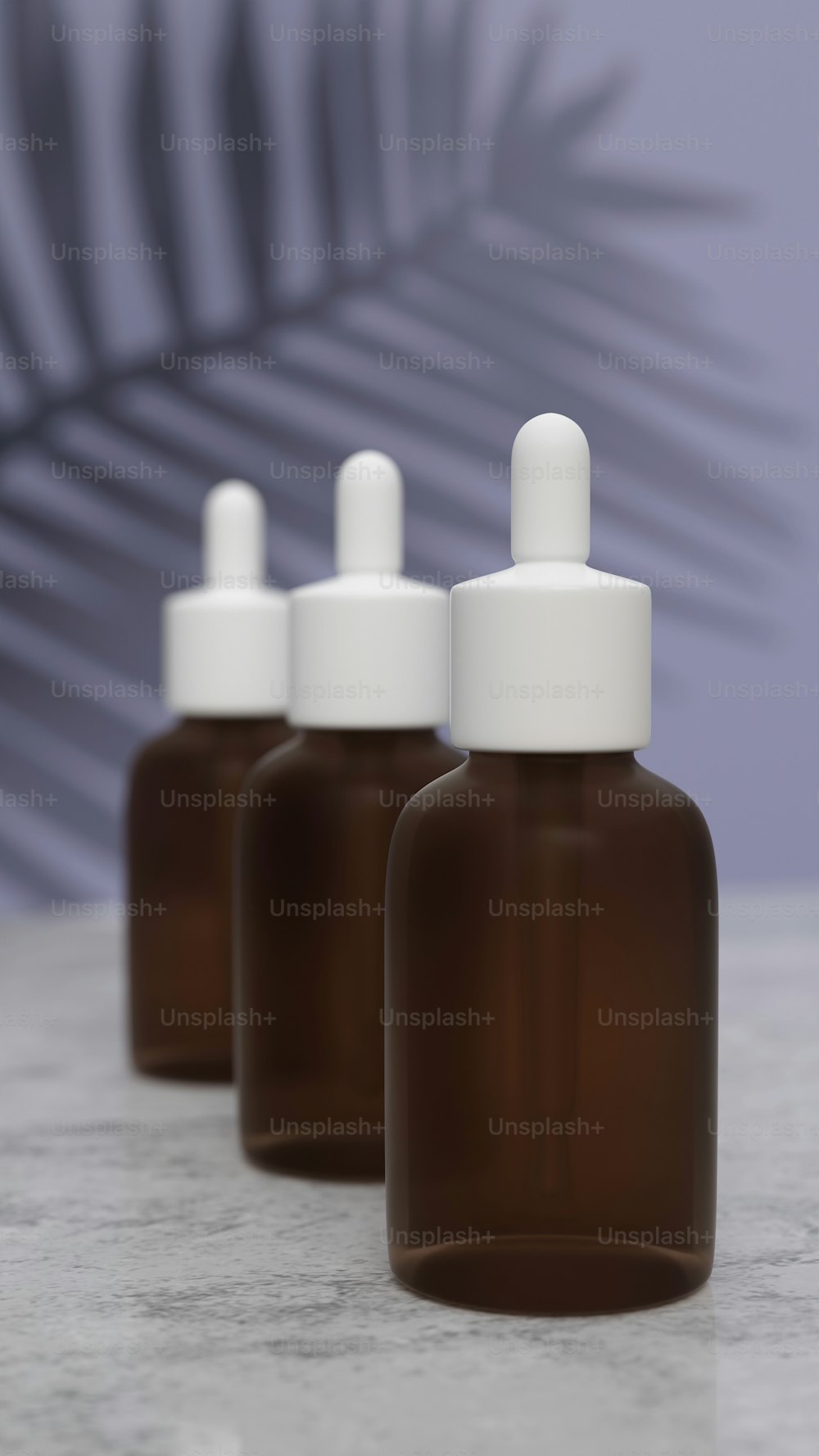 three brown bottles with white caps on a table