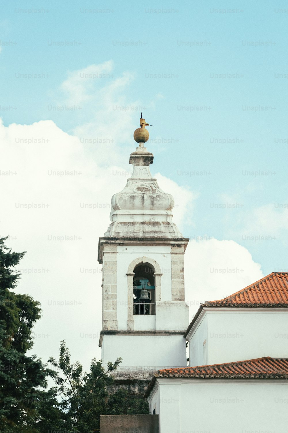 a bell tower with a bell on top of it