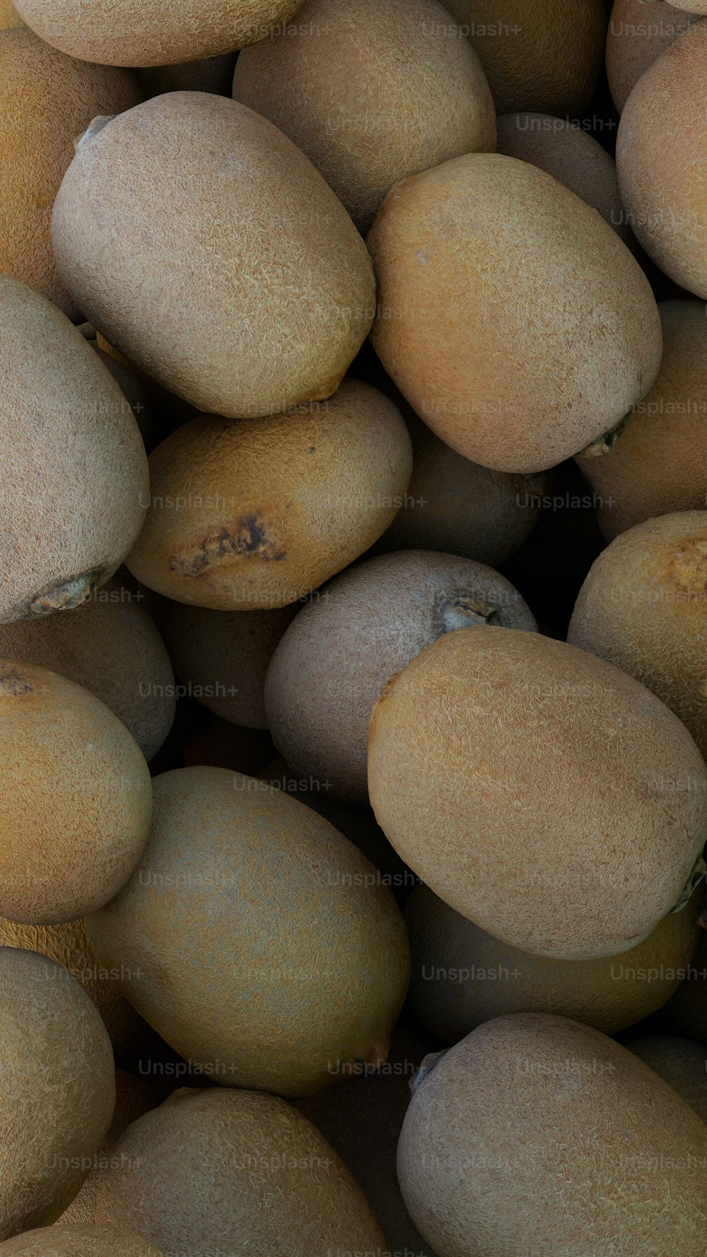 a pile of kiwi fruit sitting on top of each other