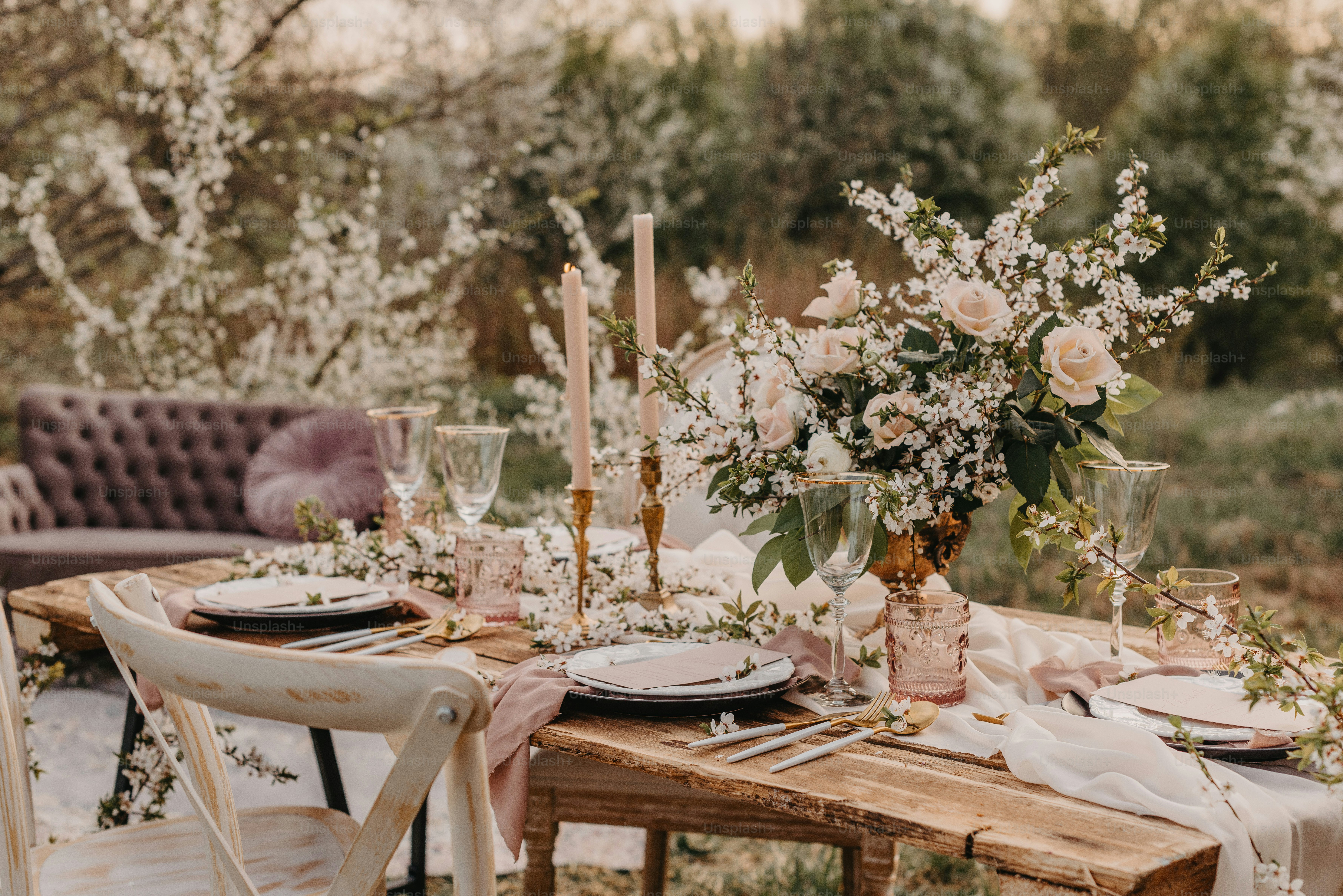 a wooden table topped with a vase filled with flowers