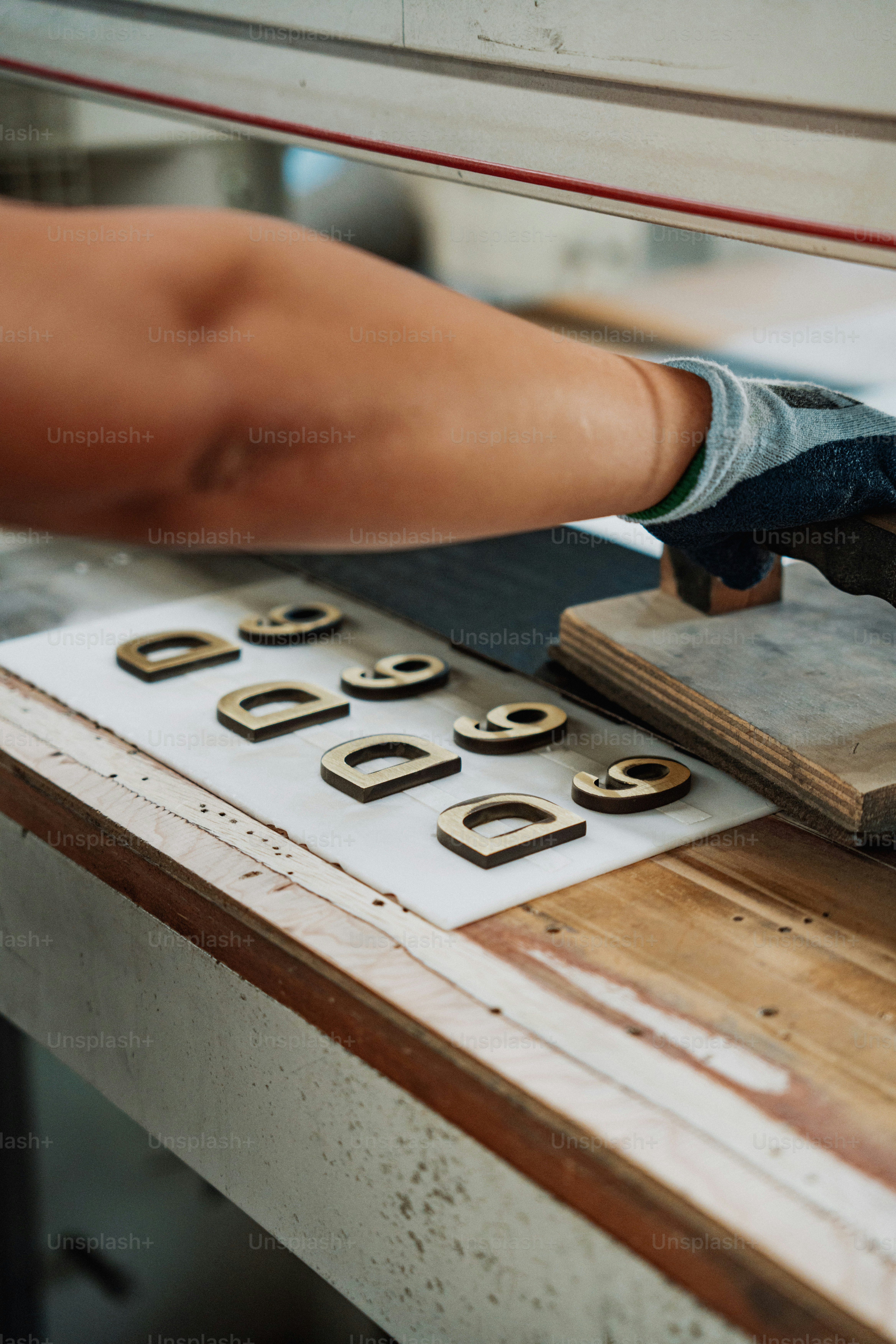 a person using a machine to cut wood