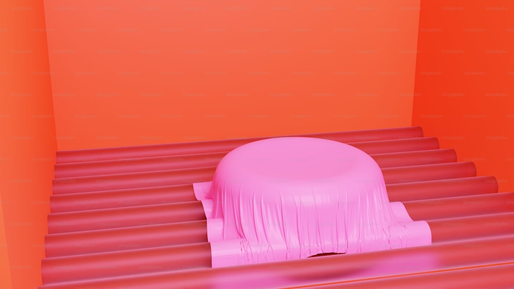 a pink object sitting on top of a red floor