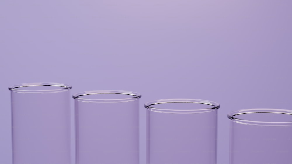 a row of glass containers sitting on top of a table