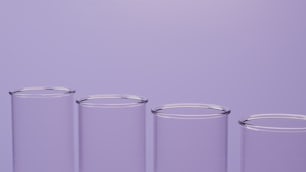 a row of glass containers sitting on top of a table