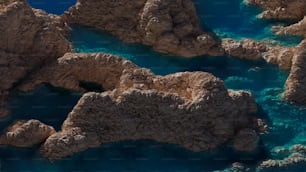 a bird's eye view of some rocks and water