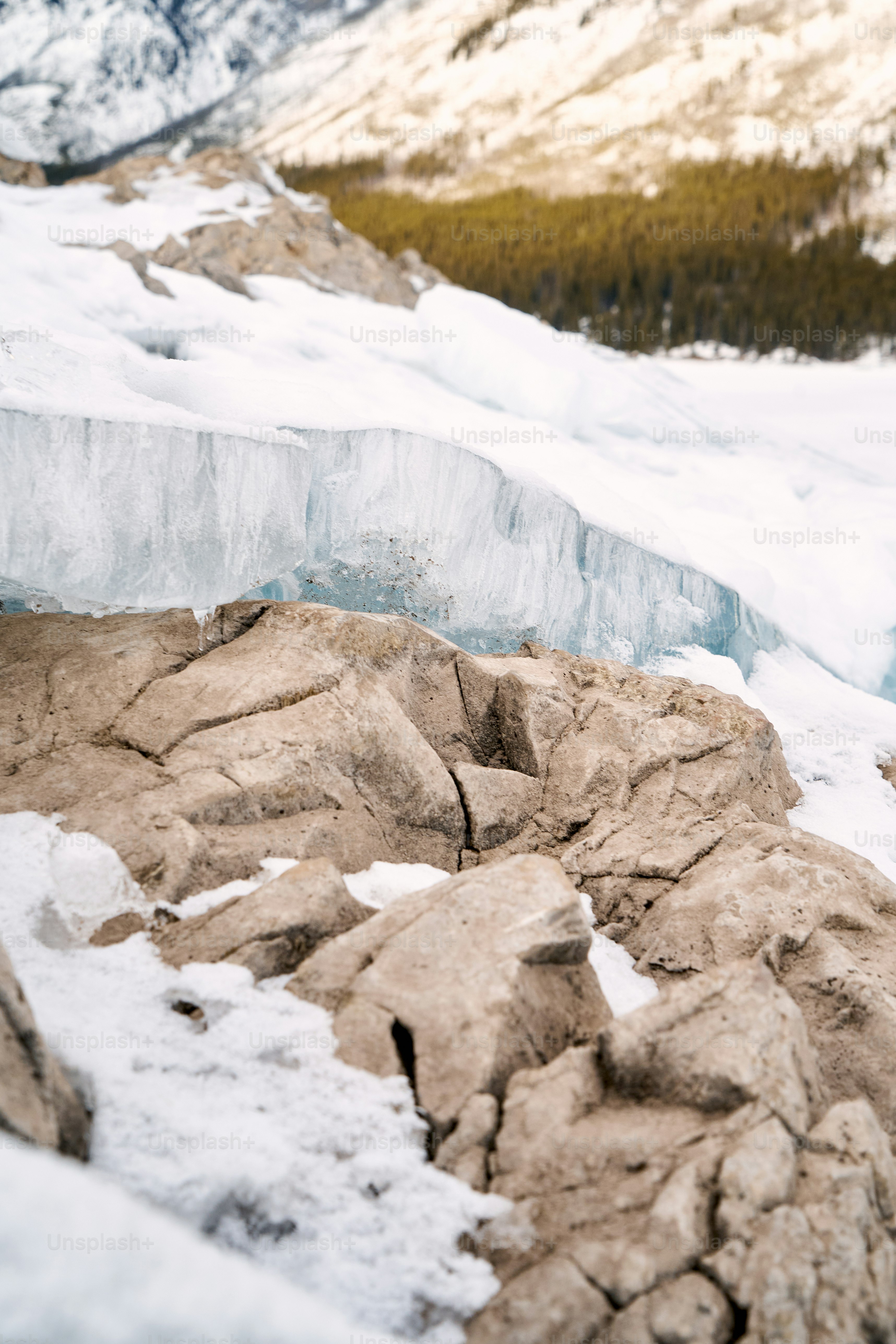 a man standing on top of a snow covered mountain