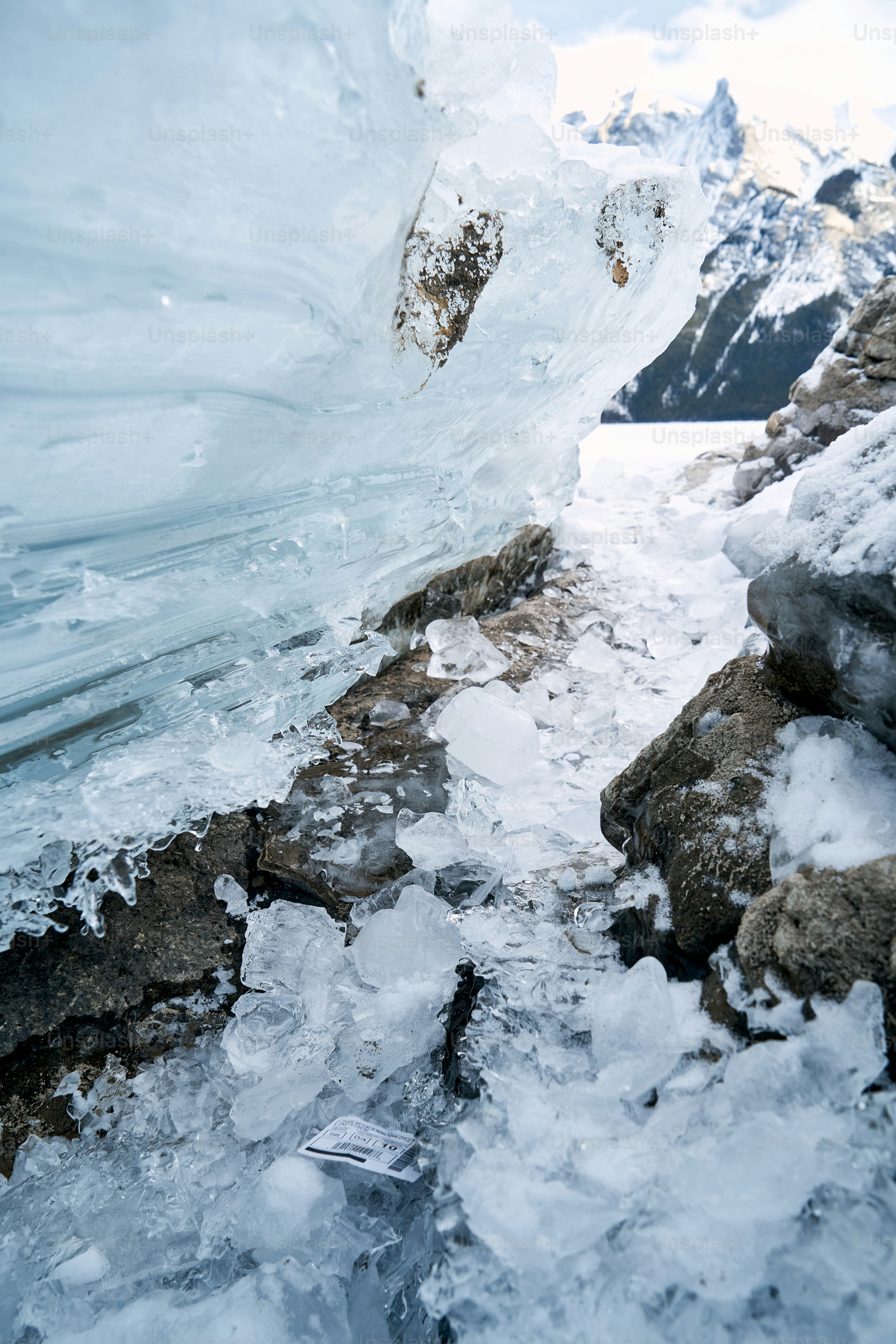 a snowboarder is going down a snowy path