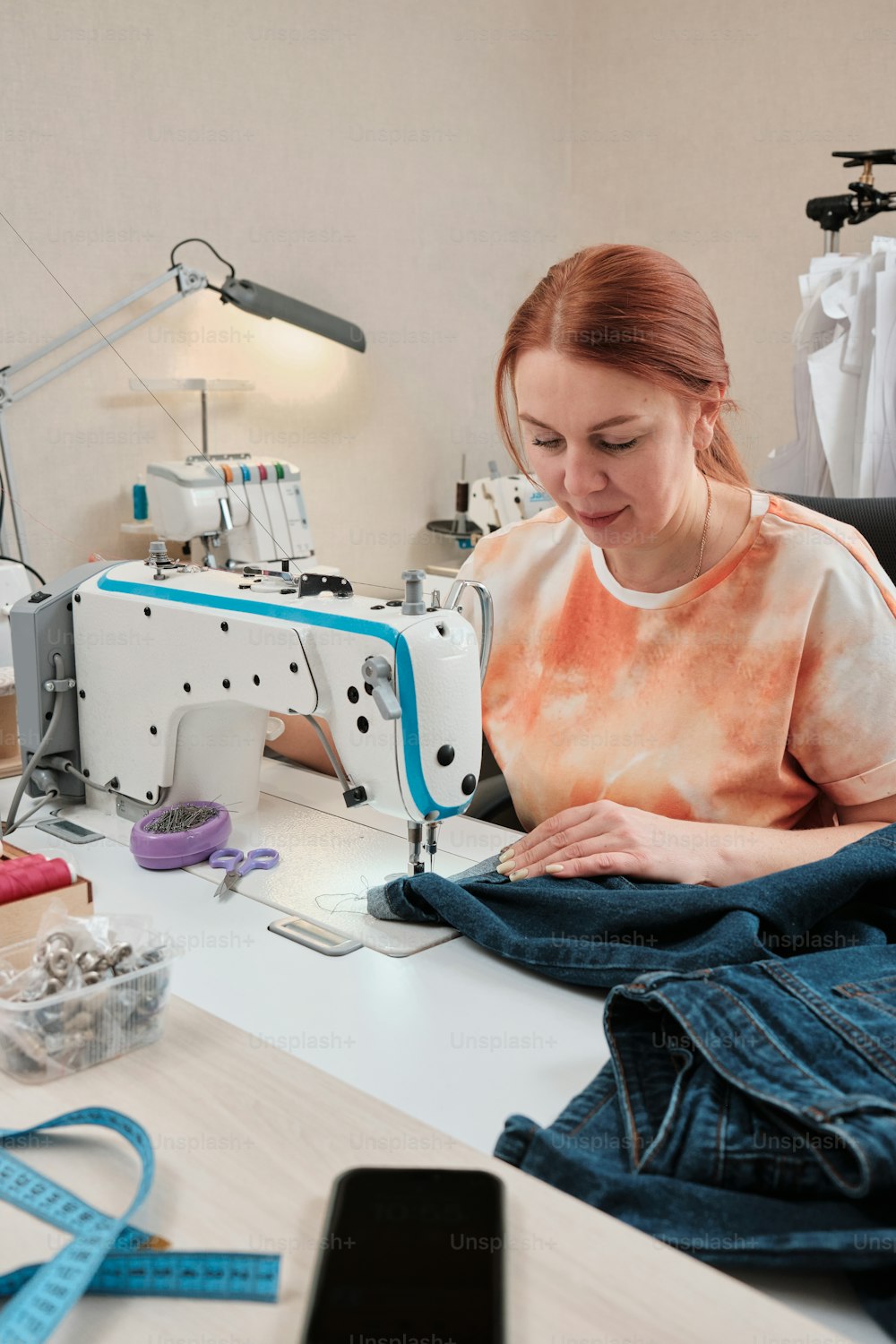 a woman working on a sewing machine