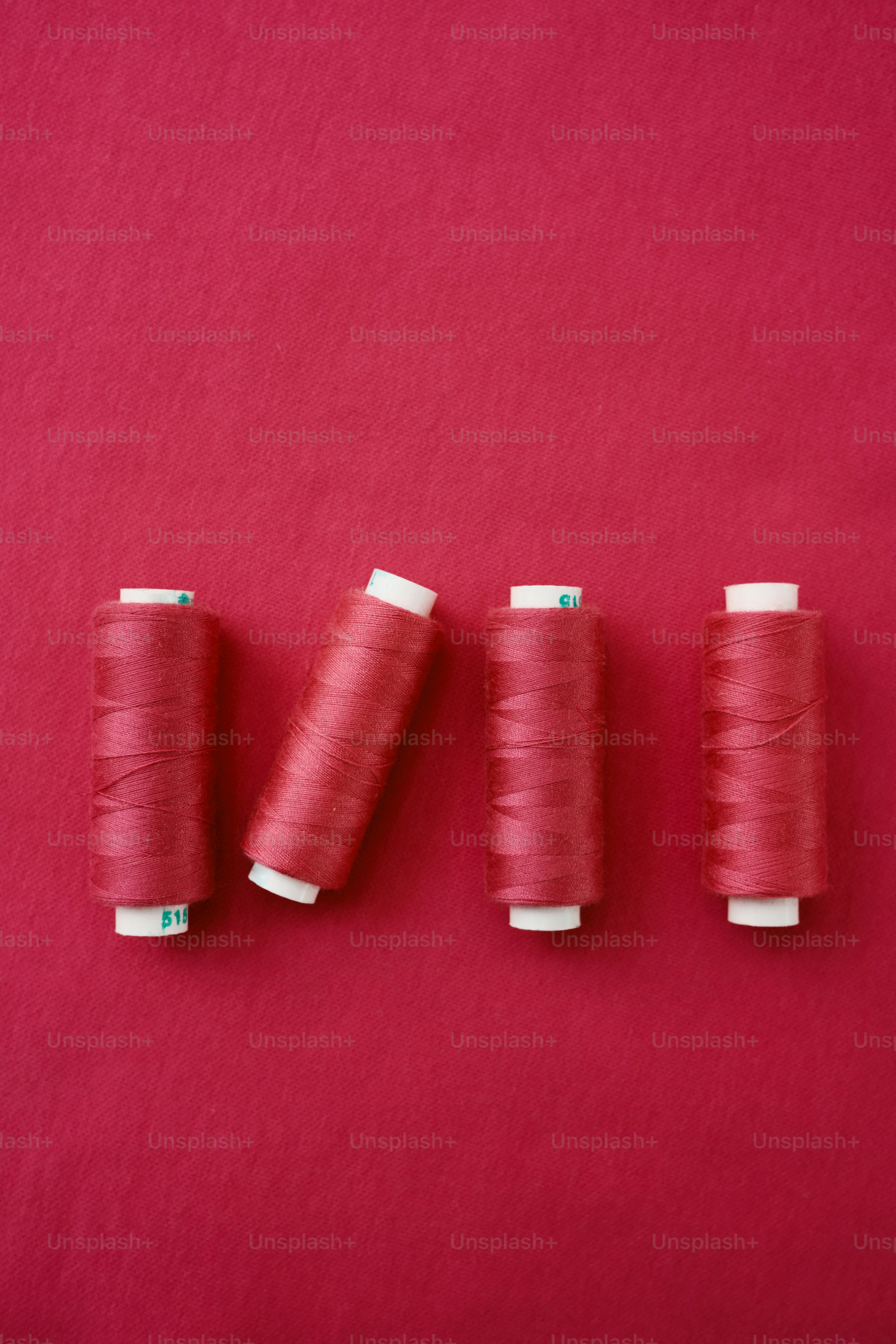 Pantone 2022 color thread spools on the fabric