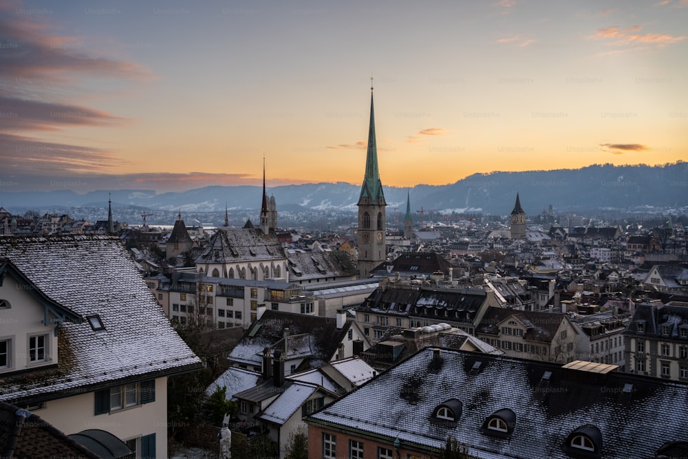 a view of a city with a church steeple in the background