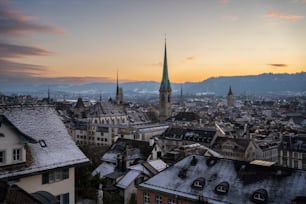 a view of a city with a church steeple in the background