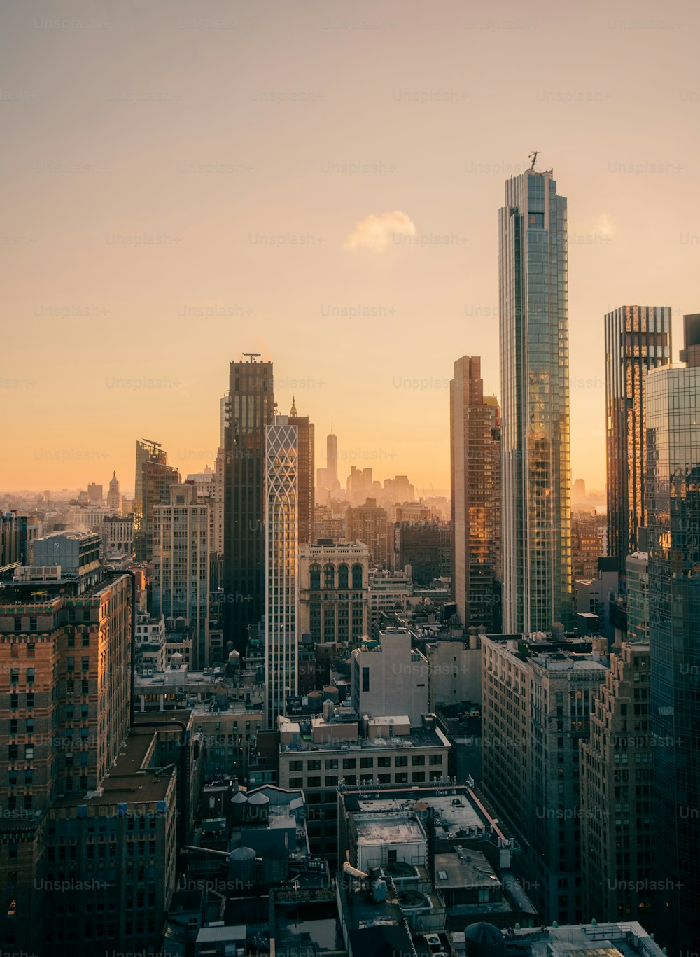 a view of a city skyline at sunset