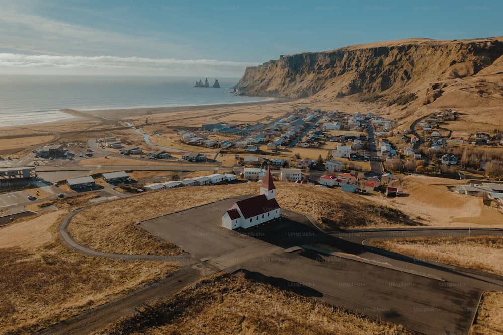 an aerial view of a small town by the ocean