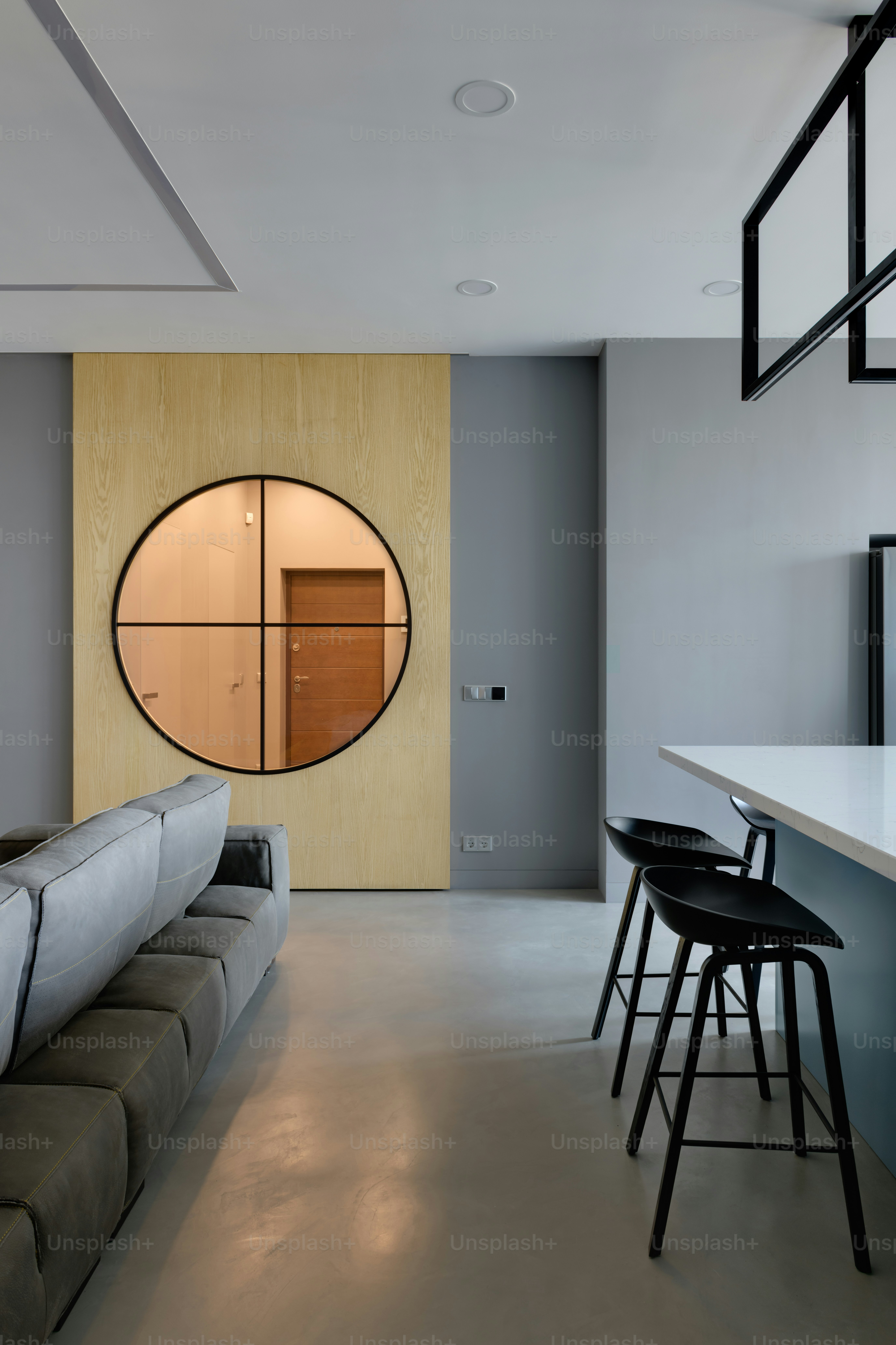 a living room with a couch a table and chairs