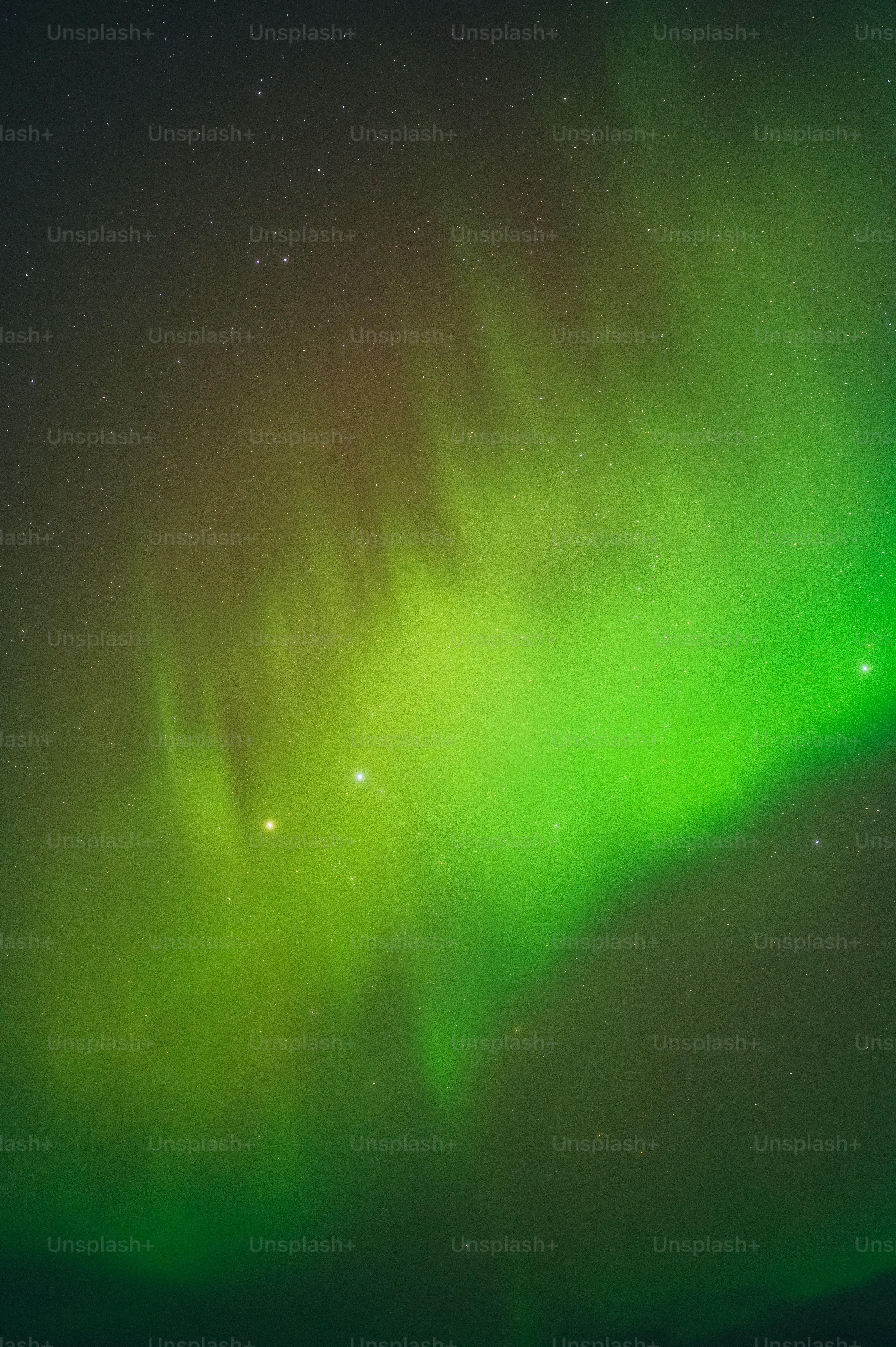 a bright green aurora bore in the night sky