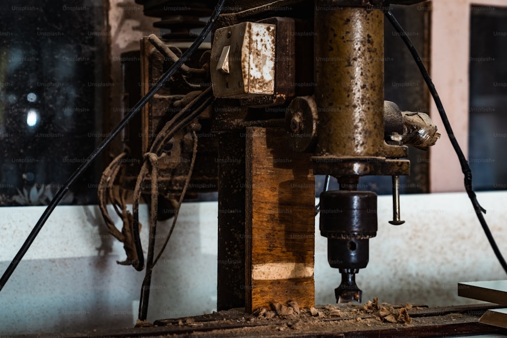 a machine that is working on a piece of wood