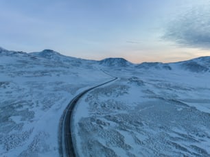 an aerial view of a snow covered mountain