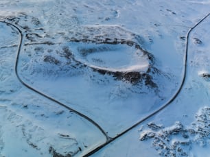 an aerial view of a snow covered landscape