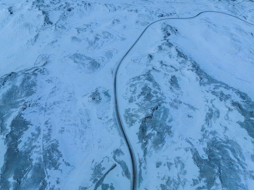 an aerial view of a snow covered mountain