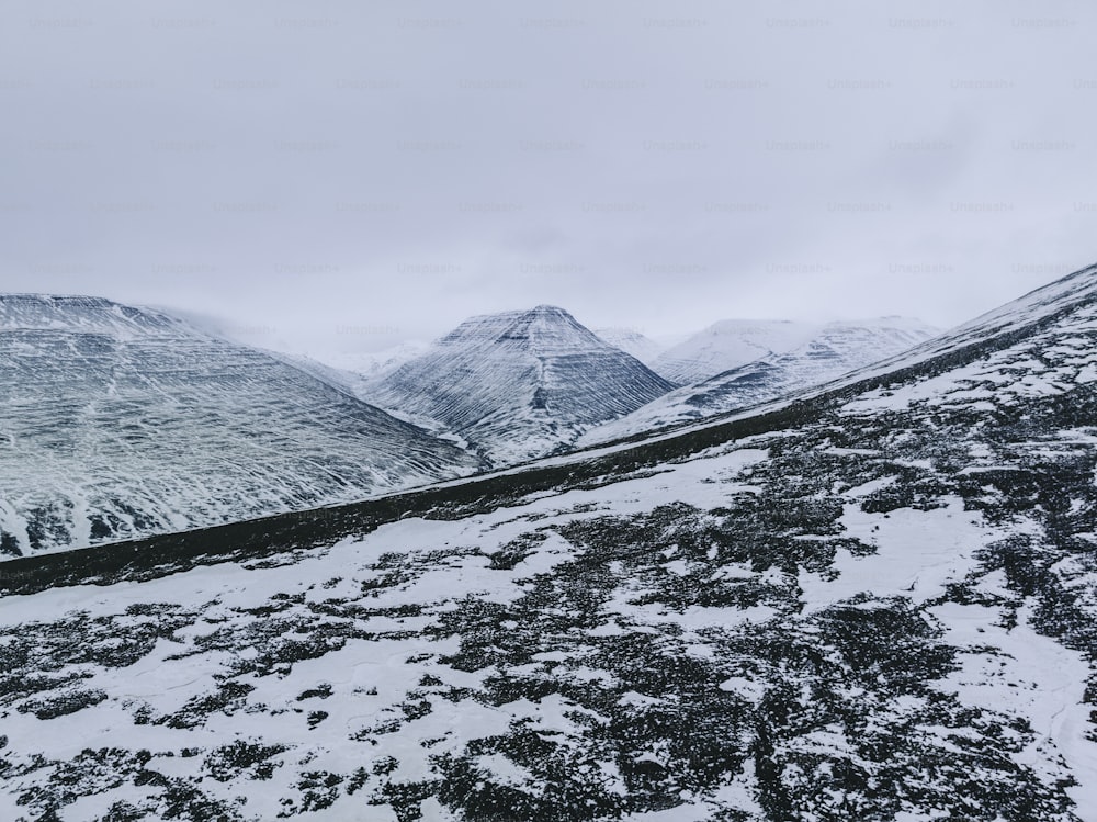 a snow covered mountain with a few snow on it