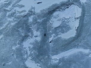 an aerial view of a snow covered landscape